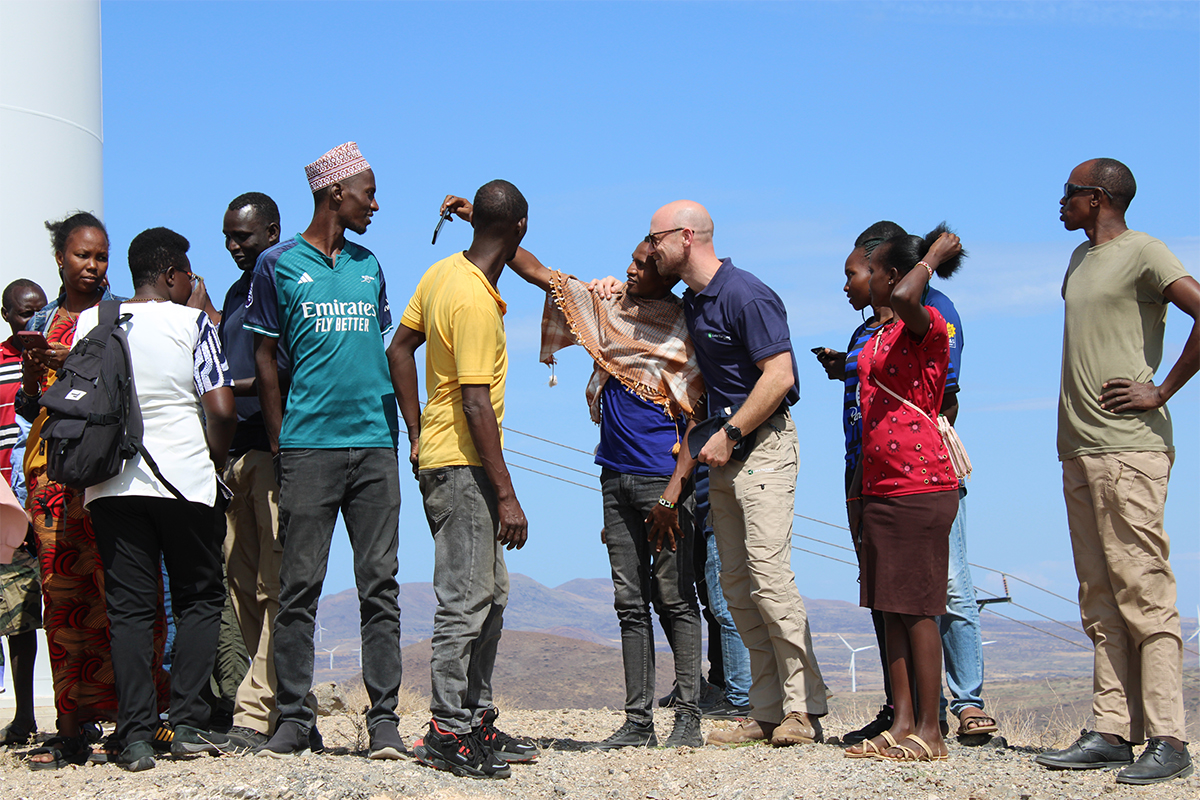 Lake Turkana Instructor taking picture with community members